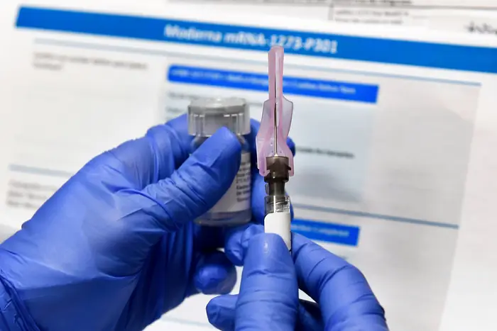 A nurse prepares a shot on July 27th, 2020 as a study of a possible COVID-19 vaccine, developed by the National Institutes of Health and Moderna Inc., gets underway in Binghamton, N.Y.